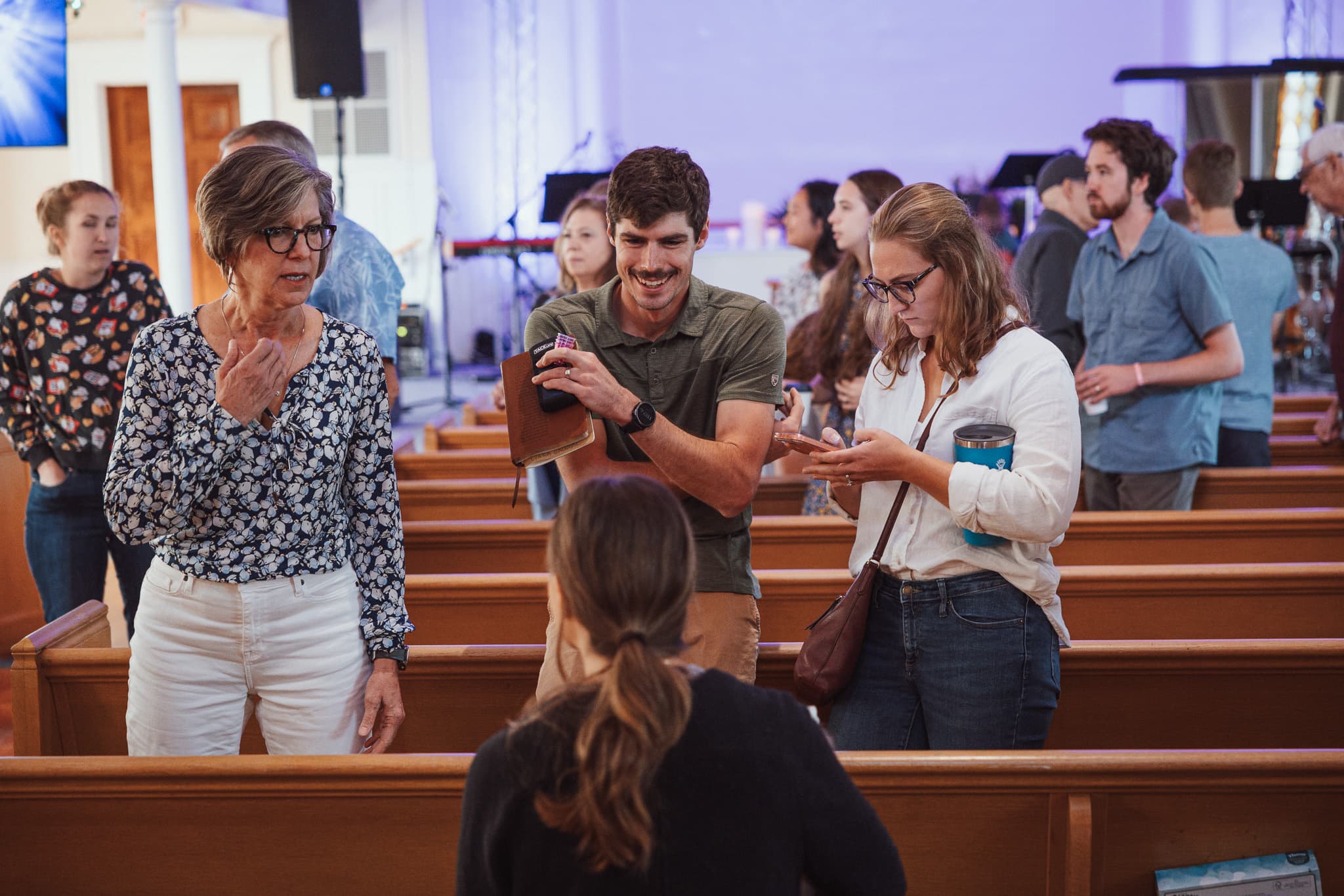 River City Church community talking in the sanctuary