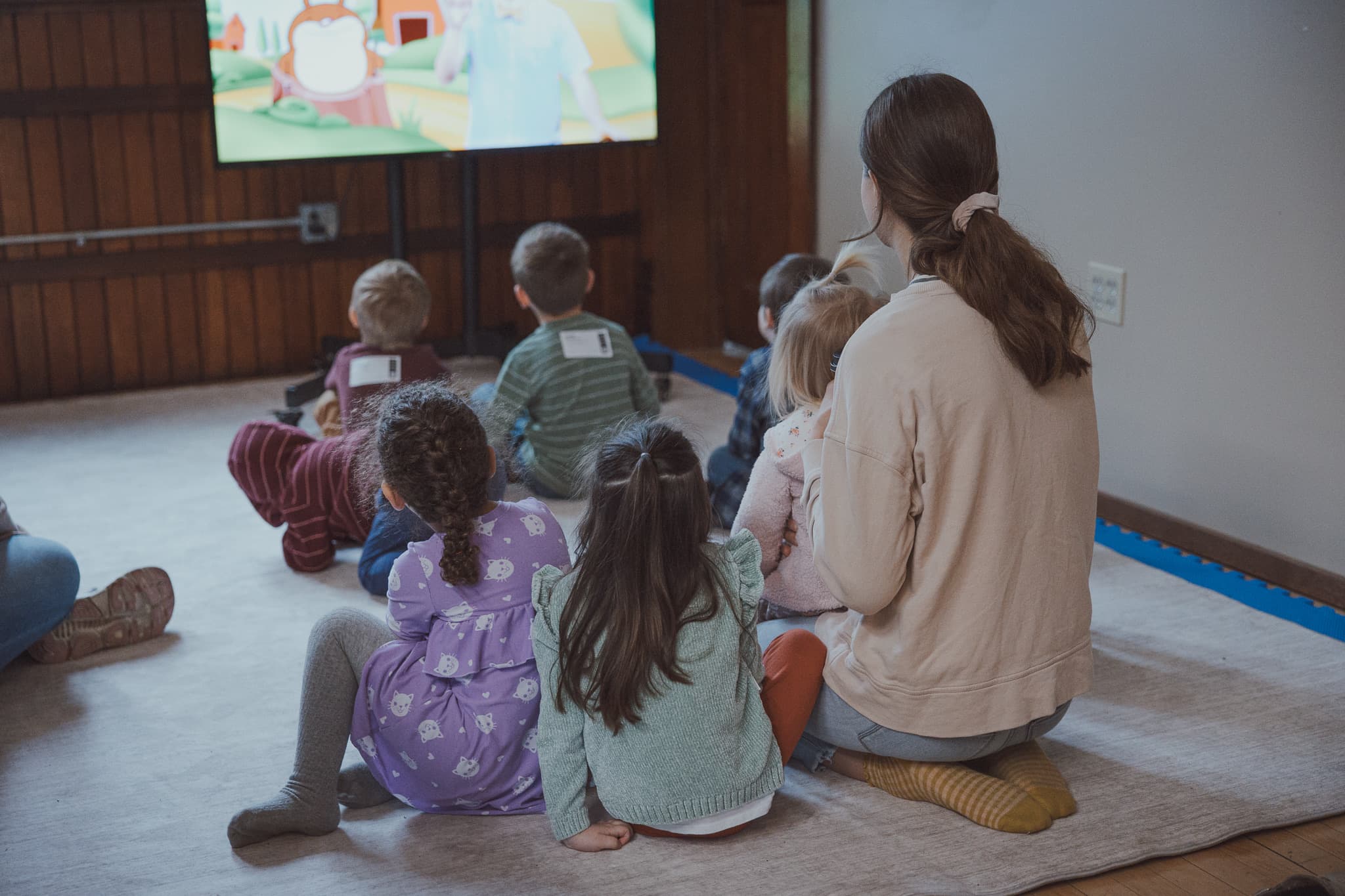 Children gathered for a calm River City Kids story and lesson time